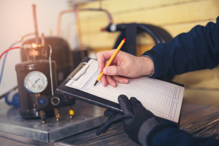 HVAC technician writing